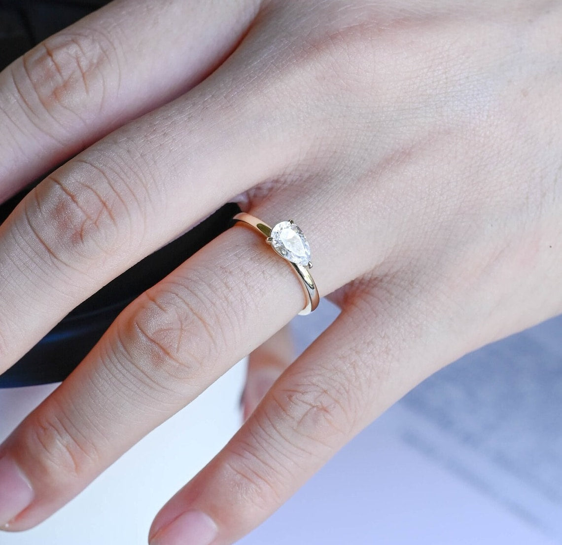 Stunning 0.8 CT Pear Moissanite Engagement Ring With East-West Solitaire Design 9