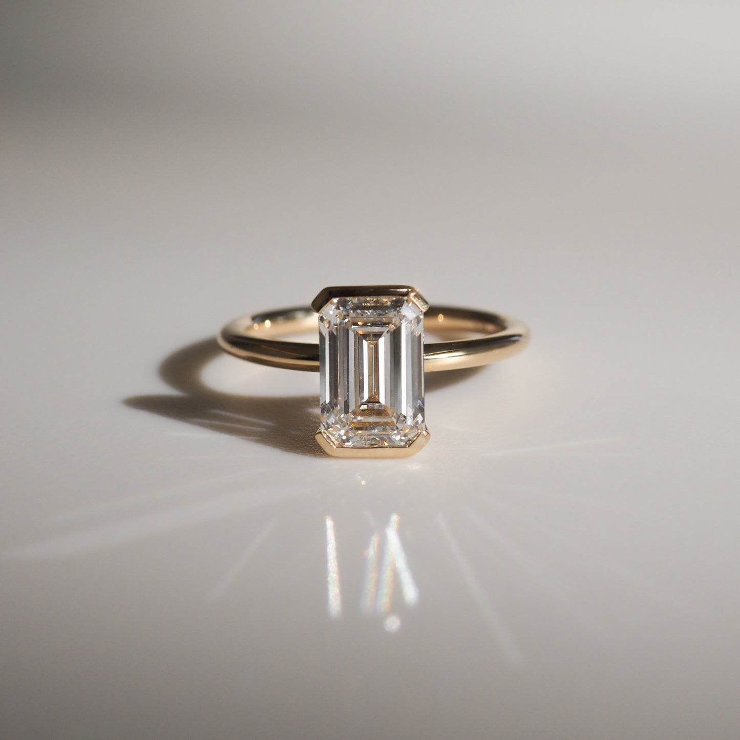 2 CT Emerald Cut Half Bezel Lab Grown Diamond Engagement Ring