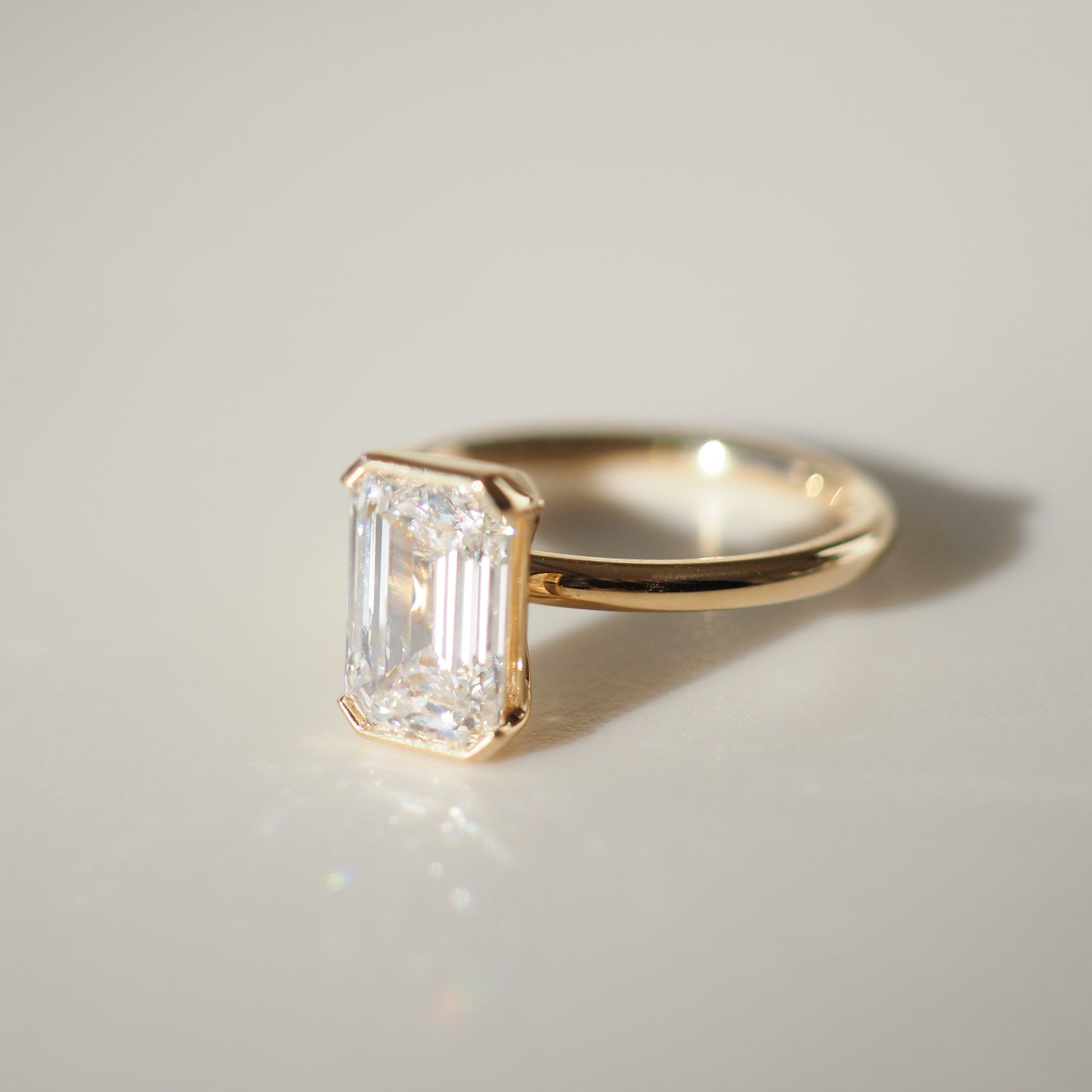 2.11 CT Emerald Cut Half Bezel Lab Grown Diamond Engagement Ring