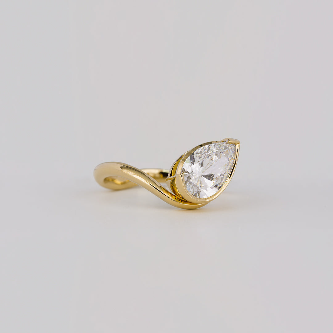 1.54 CT Pear Cut Curved Bezel Lab Grown Diamond Engagement Ring