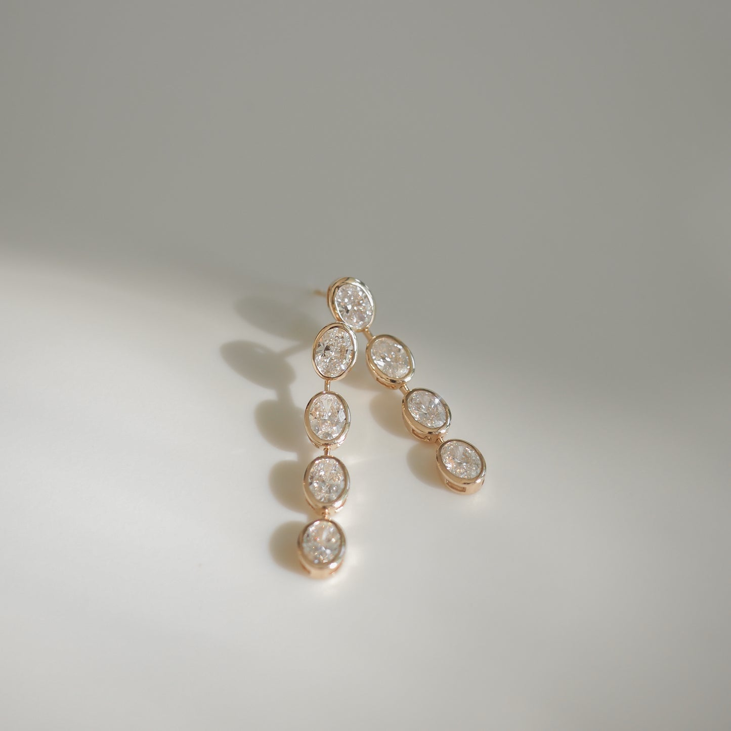 5.5 TCW Oval Shaped Lab Grown Diamond Bezel Drop Earrings