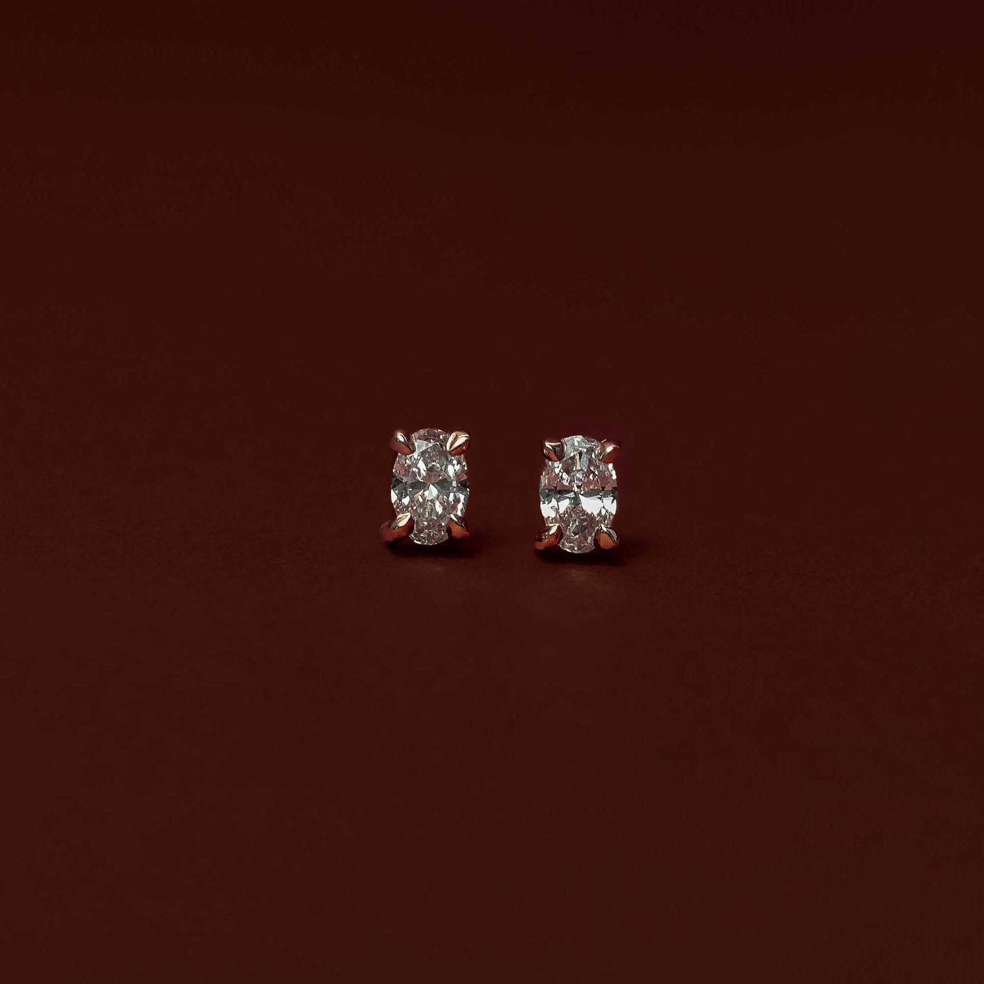 0.50 TCW Oval Cut Moissanite Stud Earrings in Gold