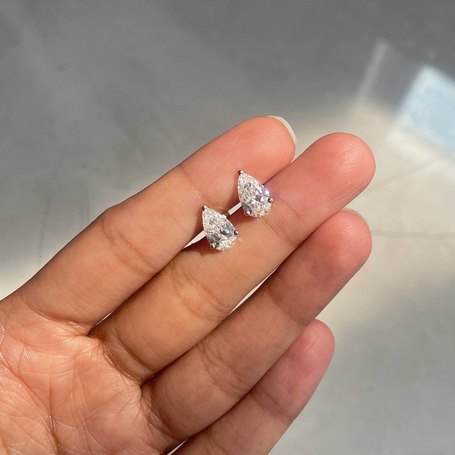 0.75 TCW Pear Cut Moissanite Stud Earrings in Gold 5