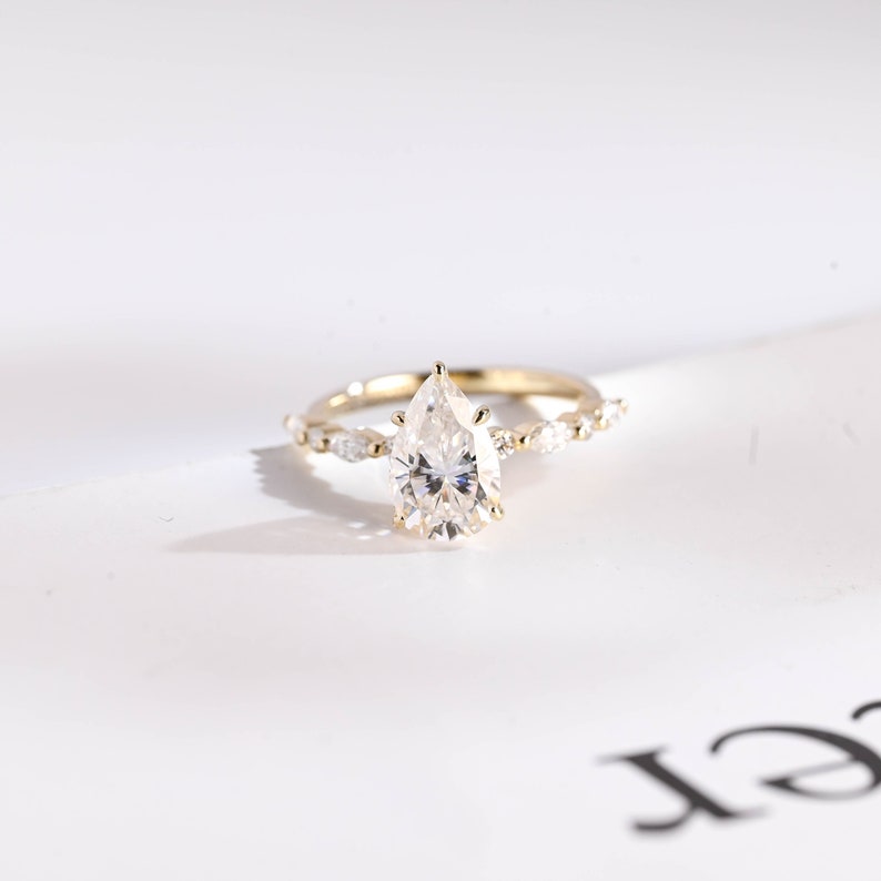 Stunning 1.0 - 2.0 CT Pear Moissanite Engagement Ring with Half Pave Design 1
