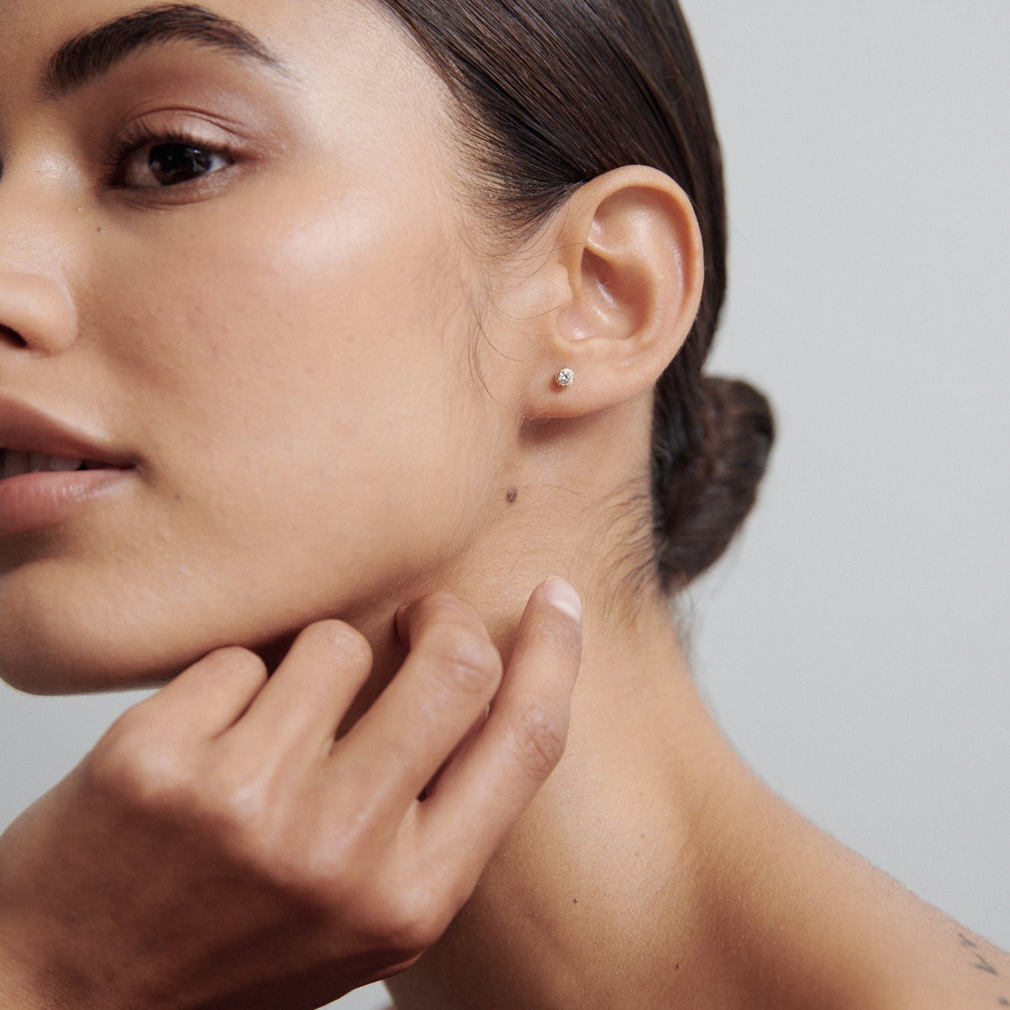 0.20 TCW Round Cut Moissanite Bezel Earrings in Gold 5