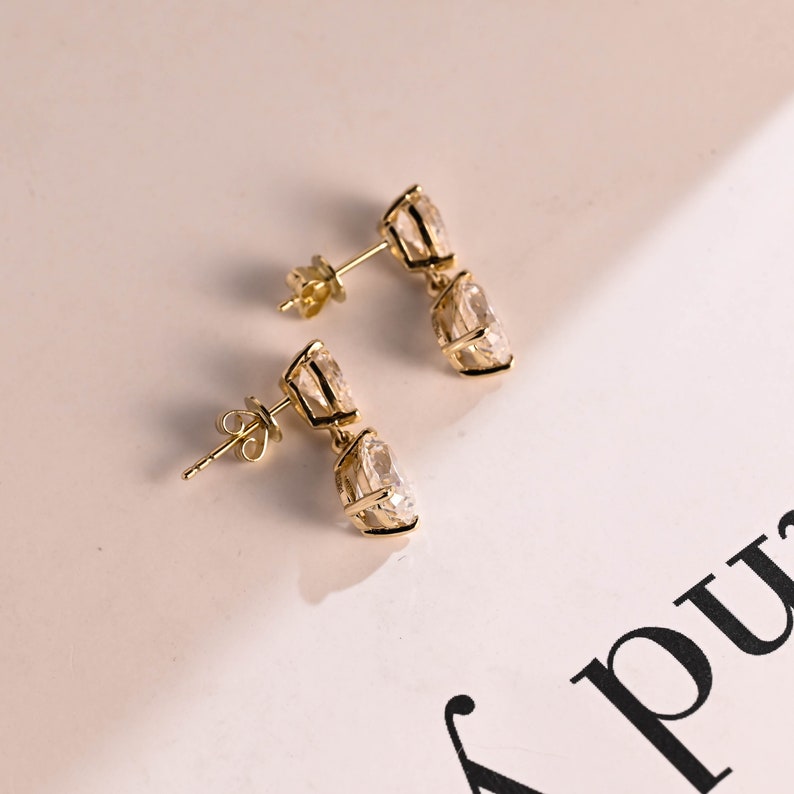 1.0 TCW Pear Cut Moissanite Drop Earrings in Gold 9