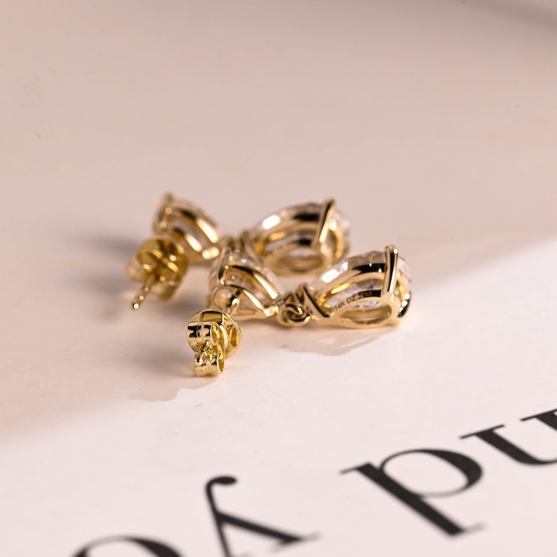 1.0 TCW Pear Cut Moissanite Drop Earrings in Gold 10