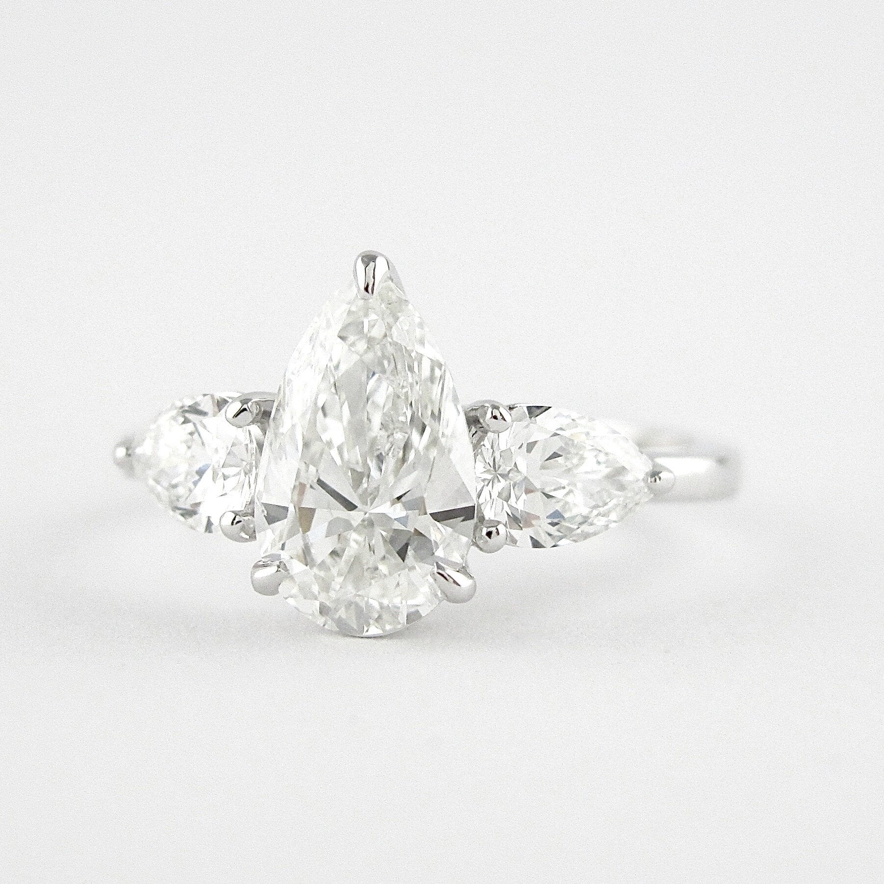 1.50 CT Pear Cut Three Stone Style Moissanite Engagement Ring 4